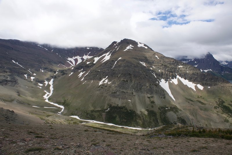 Appistoki Peak and Mount Henry sit across the valley.  In the spring, cascades move snow melt down into the lakes and reservoirs below.