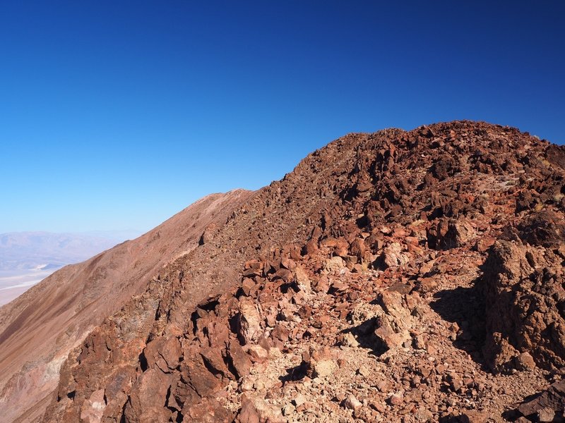 The trail gets steeper and rockier along the summit ridge