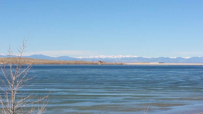 Looking across Aurora Reservoir toward the snow-capped summits of the James Peaks Wilderness.