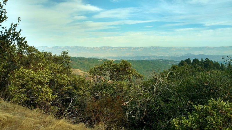 Beyond the Santa Cruz Mountains and Santa Clara Valley, is the Diablo Range in the far distance when looking east from high on Knibbs Knob Trail.