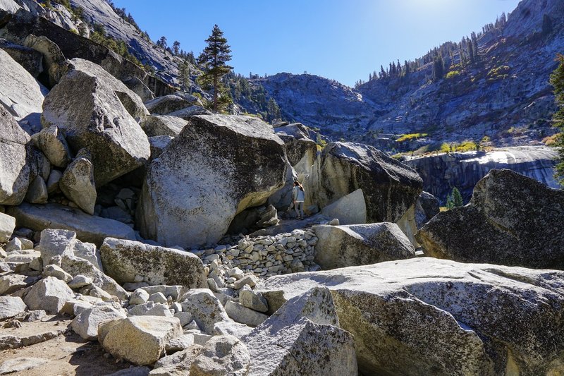 The trail winds through a large rockfall area on the way up the valley.