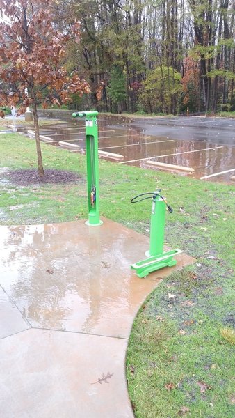 Bike repair stand and air pump in the main parking lot of Forest Ridge Park