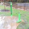 Bike repair stand and air pump in the main parking lot of Forest Ridge Park