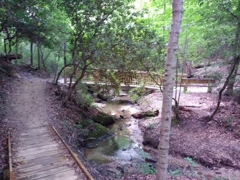 On boardwalk approaching the bridge over the first creek.