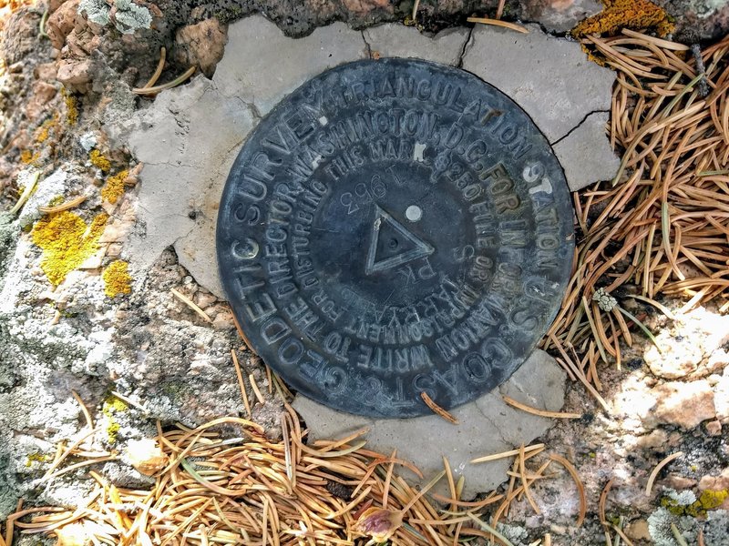 A Survey marker located on the peak.