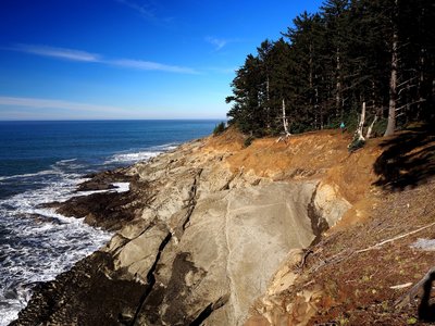 Traversing above the cliffs at Cape Sebastian (blue dot is a person)