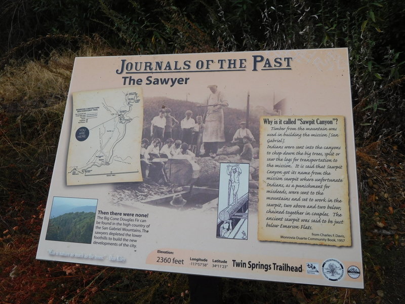 Interpretive sign on the history of Sawpit Canyon.