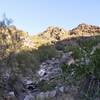 Along the Mohave Connector Trail 200, you look up to some rugged terrain without having to deal with it.