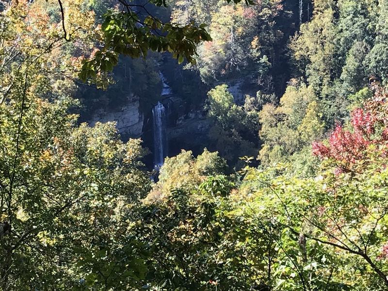 A view of Raven Cliff Falls from the over look which has a little roof shelter with benches to rest. This 400 foot fall is named for the 150 species of ravens breeding in the area and surrounding cliffs.