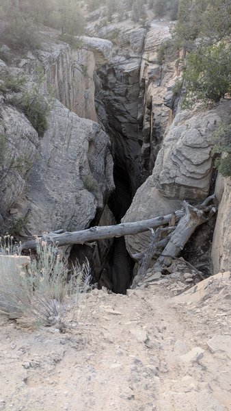 On the Bull Valley Gorge Bridge, looking down into the abyss. The entrance trail is on the right (north) rim.