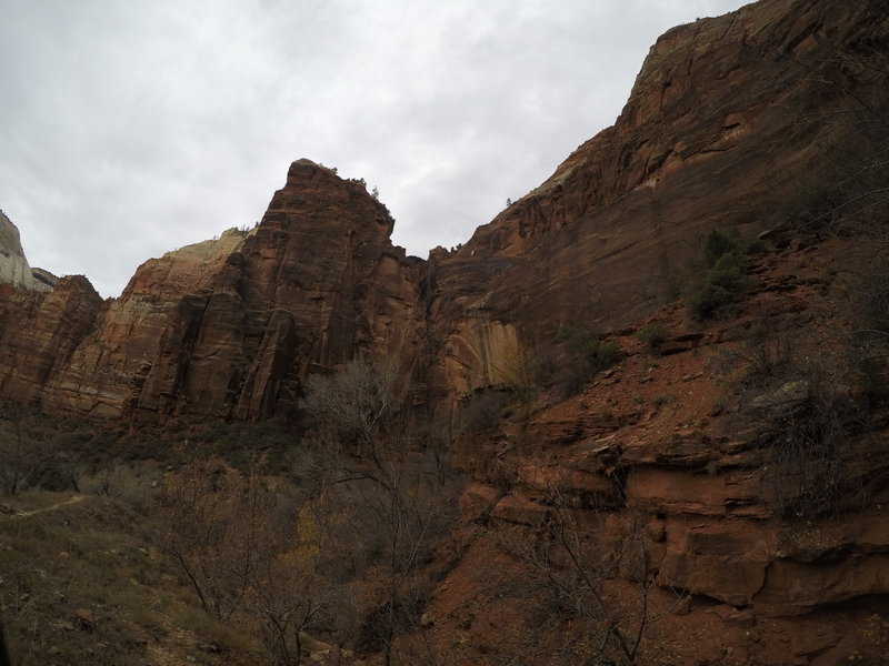 The rock wall that lays to the north of the trail.