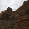 The rock wall that lays to the north of the trail.