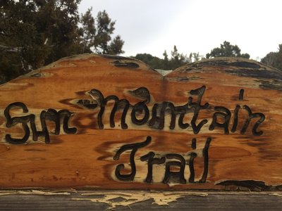 Sun Mountain trailhead sign on Old Santa Fe Trail Rd.