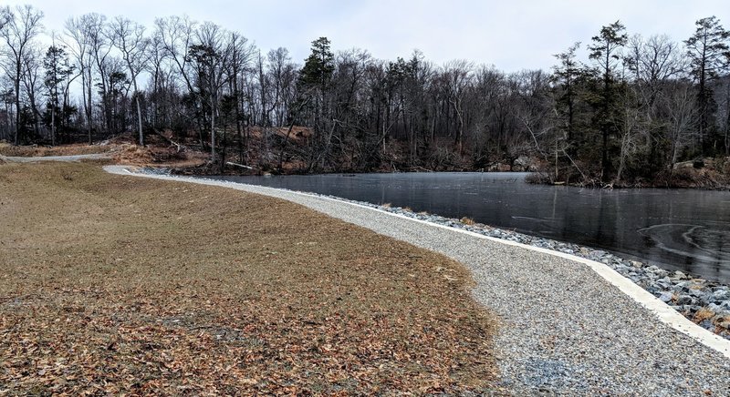 The Lake Hopatcong Trail turns into a footpath at the west end of Bear Pond.