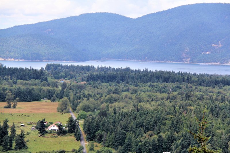 Edens Road valley with Cypress Island and Atlantic salmon pens in background