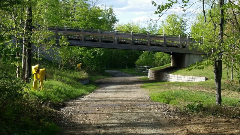 Passing under the skier bridge, you're almost home free! Ride the easy descent along Home Run back to the Village.