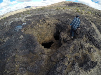 A couple of the holes that drop into the lava tube.