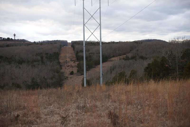 There are 3 areas where a power line crosses the trail.   From this view, you can see where the power lines split.  It provides an opening to see the surrounding hills and a break from walking through the woods.