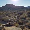 Person screen left following trail drops to valley floor, what a view! Boulders, brush and cactus a plenty oh my! This is trail counter-clockwise and start of W side leg after dam wall. About 315pm so facing W rocks are in shadow.