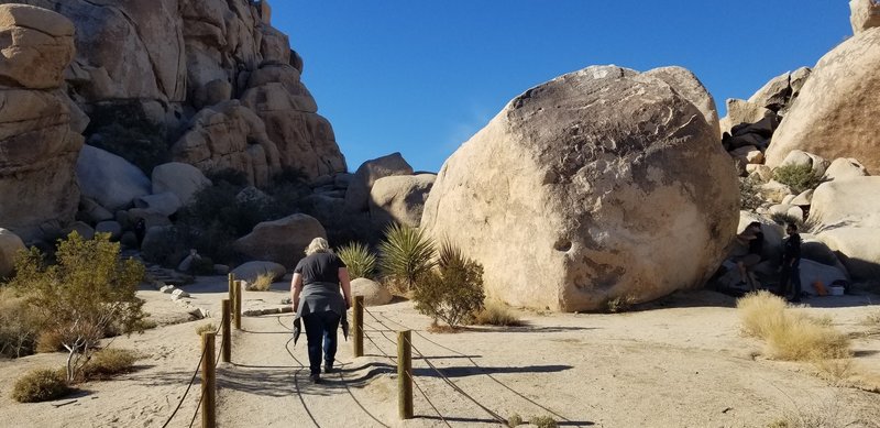 Very beginning of trail. You'll climb up and over the shadowy low area in the center, via man made steps. This gives you access to the contained valley.