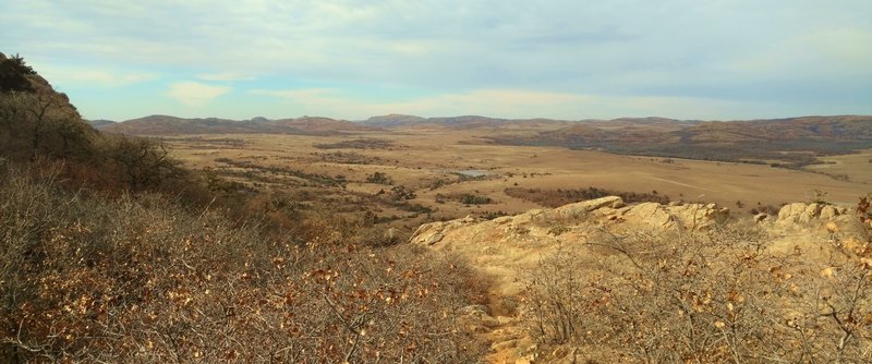 With an Elk Mountain shoulder to the left, Elk Mountain Trail heads northwest with views of Caddo Lake, the prairie, and Wichita Mountains.