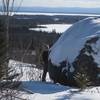 Julian at Daredevil Rock on E4. Watch out skiers below!