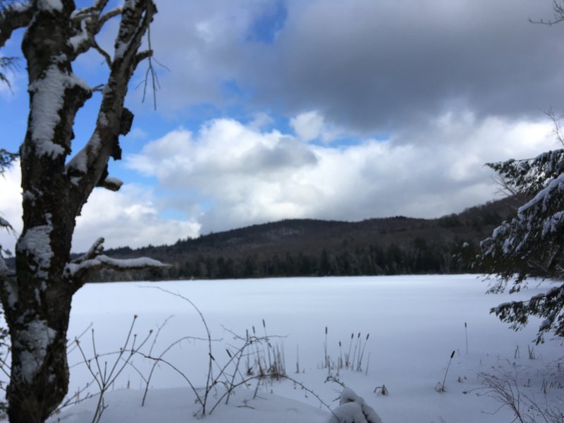 Frozen Lake under Cloudy Skies.