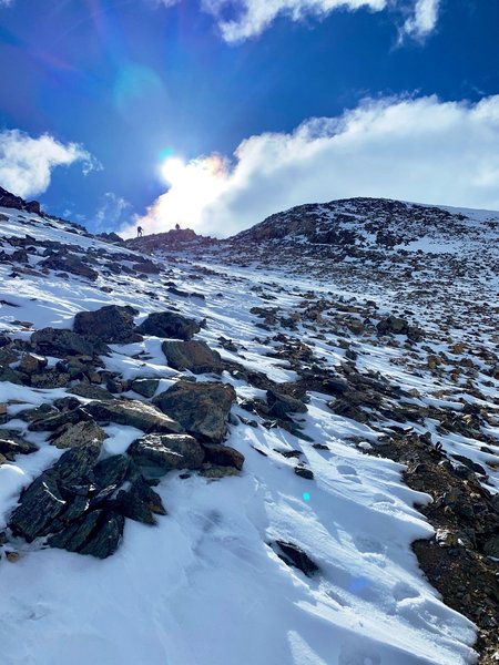 Loose rock and slushy snow.