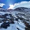 Loose rock and slushy snow.