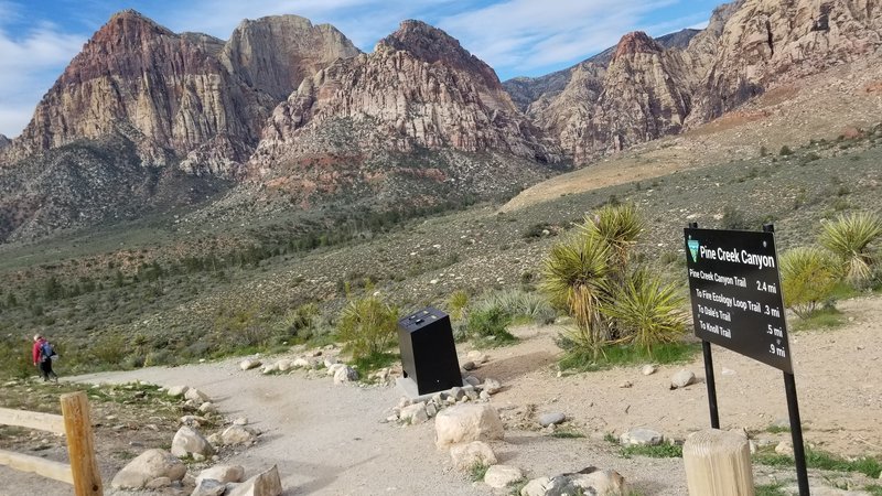 Pine Creek Canyon seen behind its trailhead sign.