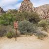 One of several trail junction signs along Pine Creek Trail.