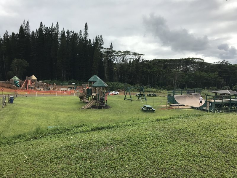 Playground and skatepark area at Anaina Hou Community Park.  Trailhead behind the playground.