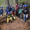 Blues Crew celebrating the repair of a large root ball hole in the trail.