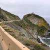 Even beneath overcast skies, appreciating the sharp contrast between rock and sea demands more time than cars will ever provide.