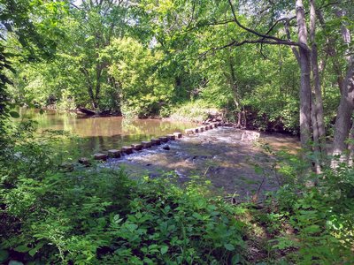 One stone is broken; easy for long legs, feasible with help if you're shorter.