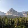 A peak through the trees at the mountains across the Cut Bank Creek