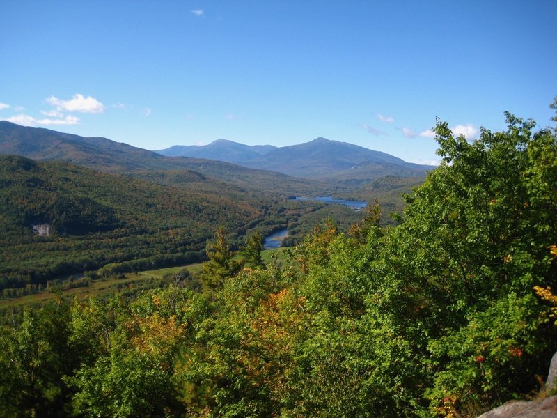 View west from the summit of Mt. Crag showing Mt. Madison, Adams, and Jefferson as well as the Androscoggin River.