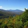 View west from the summit of Mt. Crag showing Mt. Madison, Adams, and Jefferson as well as the Androscoggin River.