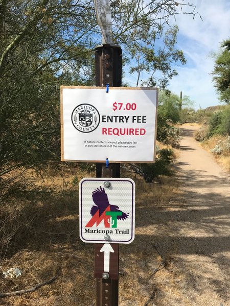 Remember to pay the parking fee if you start within the park. Example of the Maricopa Trail badge and arrow that you should follow.