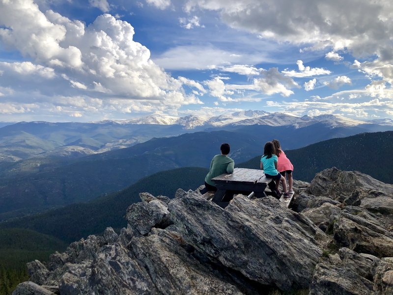 Picnic table behind the lookout tower. Mt. Evans on the horizon.