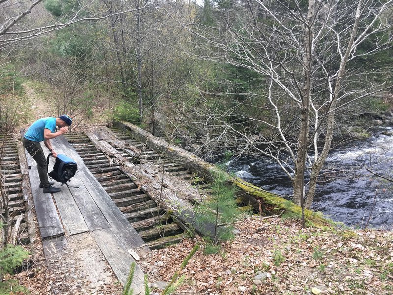 Bridge crossing Round Lake outflow, looking south.