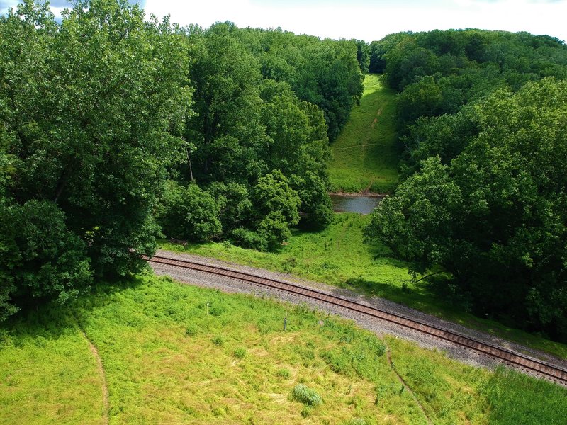 View from intersection of Drivers Road East and the Wood Marr trails, looking at the railroad and the Patapsco Thru Trail Woodstock section across the river.