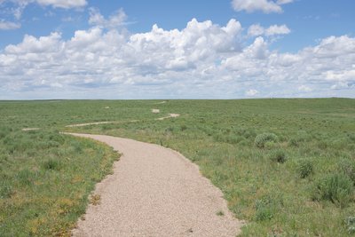 You can see the trail meandering through the high plains. You'll notice there is no shade, so make sure to bring plenty of water, apply sunscreen, and wear a hat.