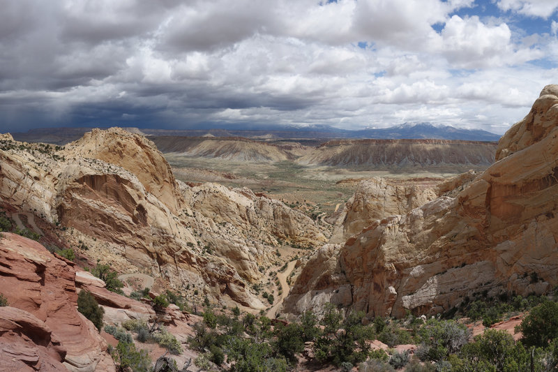 Burr Trail descending the Waterpocket Fold with a storm to the east.