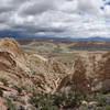 Burr Trail descending the Waterpocket Fold with a storm to the east.