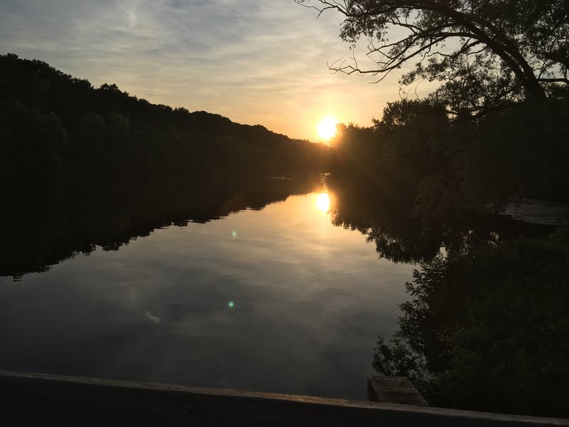 View from wooden vehicle bridge facing west.