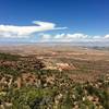 View North to the Colorado River and Horse Thief Bench beyond. From the mesa top above the arches.