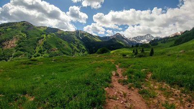 Crossing the meadows of Capitol Ditch Trail