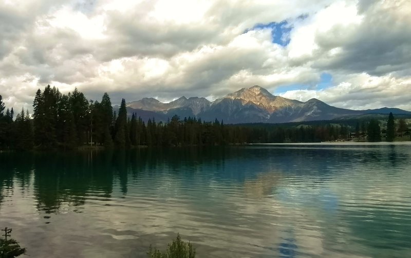 Lac Beauvert with Pyramid Mountain in the distance (center).