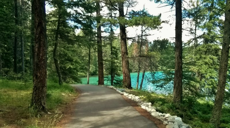 The wooded, 2.6 km (1.6 mile), ADA accessible trail around beautiful, turquoise Lake Annette.